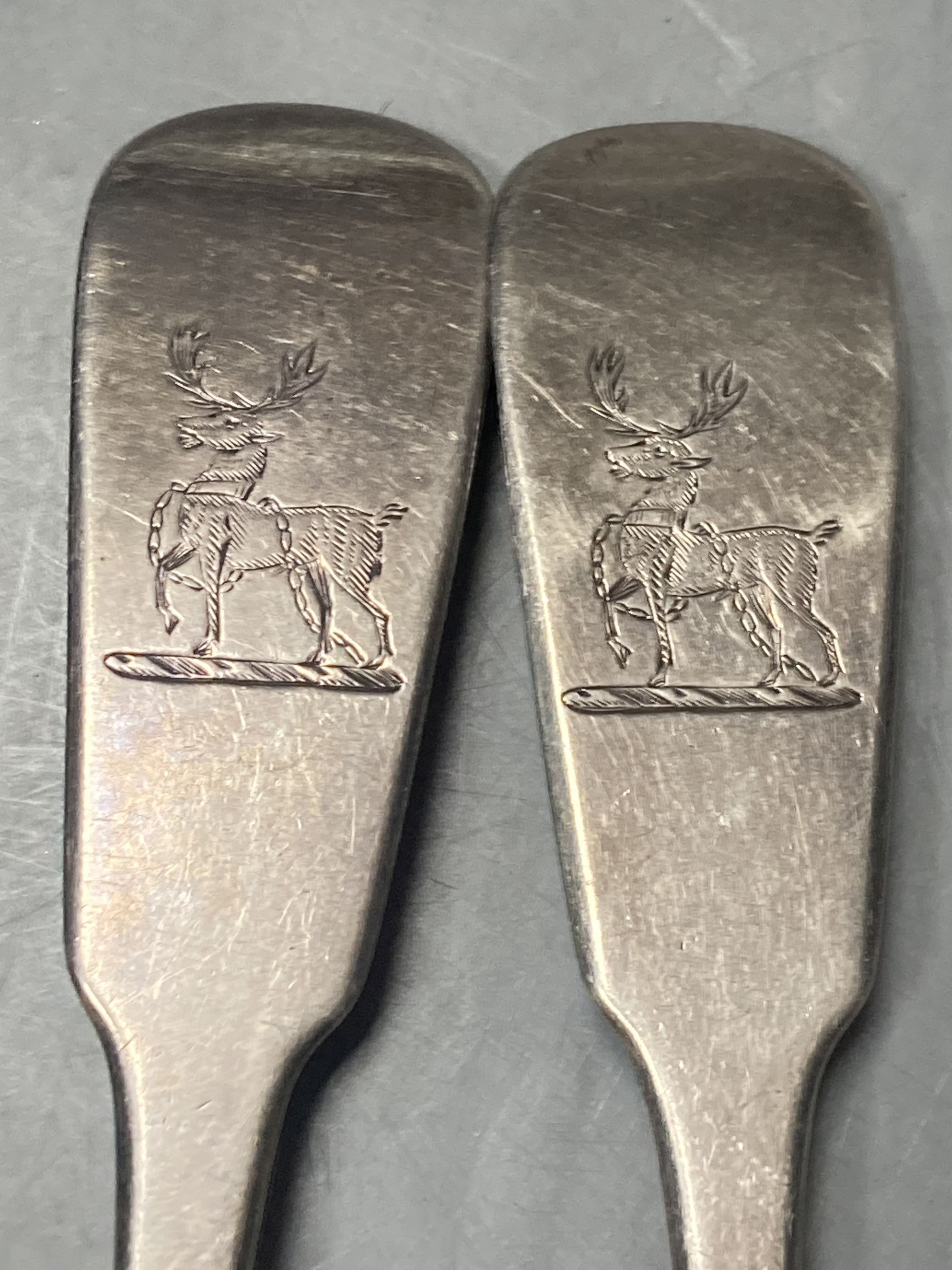 A pair of late George III Irish silver fiddle pattern table spoons, Samuel Neville, Dublin, 1816/17, 29.7cm, 7.5oz.
